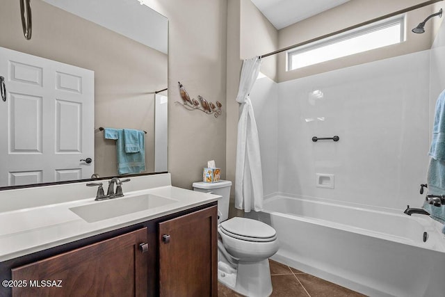 bathroom featuring tile patterned floors, toilet, vanity, and shower / bath combo with shower curtain