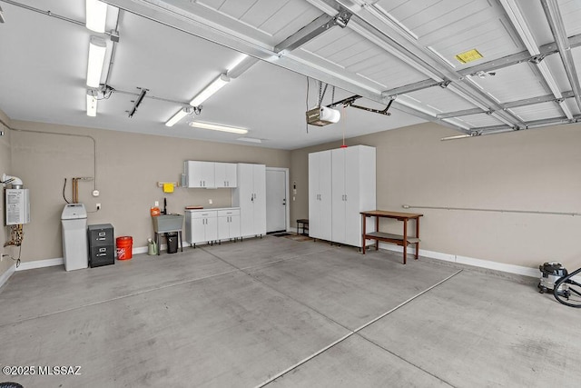garage featuring baseboards and a garage door opener