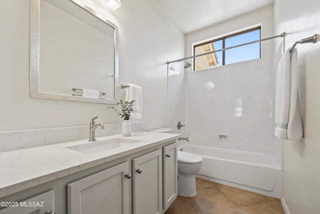 bathroom with tile patterned floors, bathing tub / shower combination, toilet, and vanity
