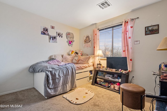 carpeted bedroom featuring visible vents and baseboards