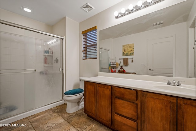 full bath featuring toilet, vanity, visible vents, and a stall shower