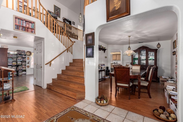 interior space featuring arched walkways and stairs