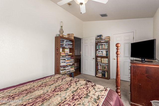 bedroom featuring visible vents, a ceiling fan, carpet, and vaulted ceiling
