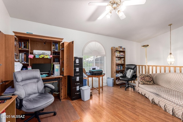 home office with ceiling fan, wood finished floors, and lofted ceiling