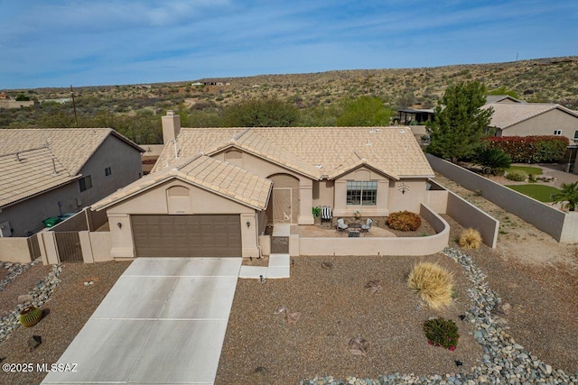 36526 S Wind Crest Dr, Tucson, AZ 85739 - single story home featuring a gate, concrete driveway, stucco siding, an attached garage, and fence private yard