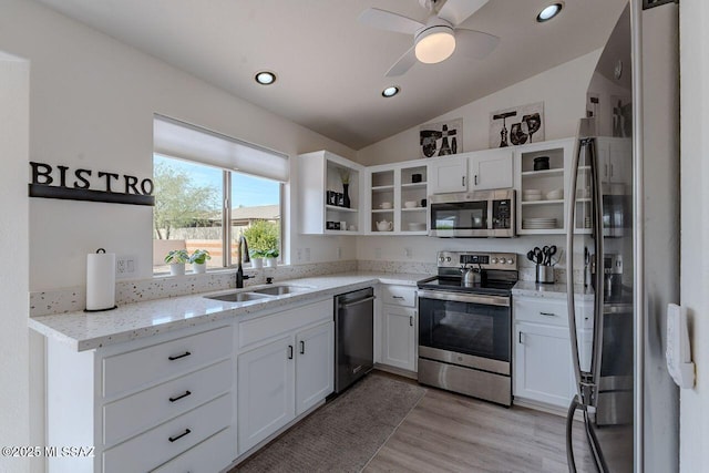 36526 S Wind Crest Dr, Tucson, AZ 85739 - kitchen featuring white cabinets, stainless steel appliances, lofted ceiling, a sink, and open shelves