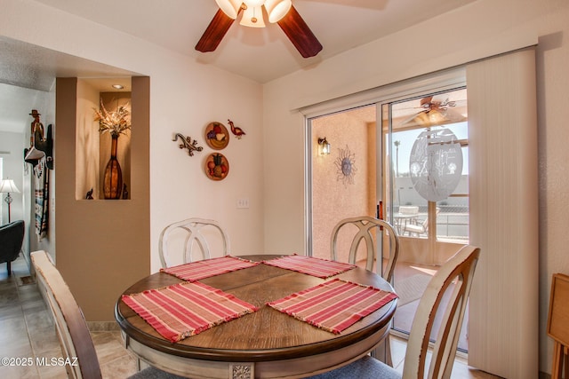 dining room featuring ceiling fan