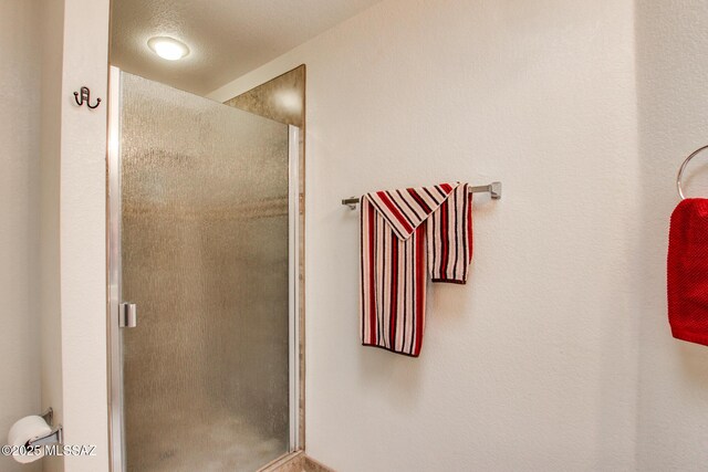 full bathroom featuring a stall shower