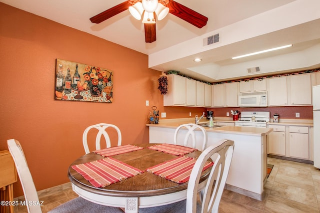 dining room featuring a ceiling fan and visible vents