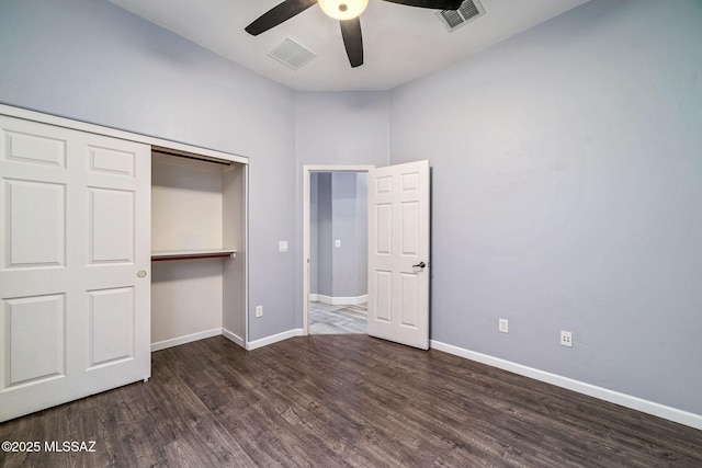 unfurnished bedroom with baseboards, wood finished floors, and visible vents