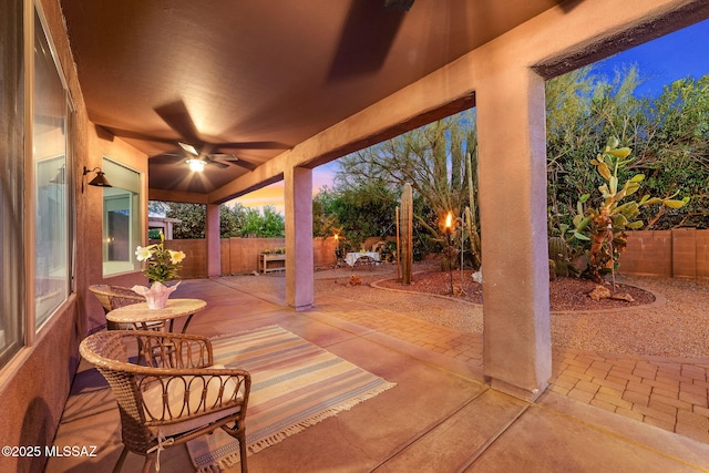 view of patio / terrace featuring a fenced backyard and a ceiling fan
