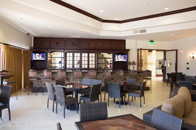 dining space with recessed lighting, crown molding, visible vents, and light tile patterned floors