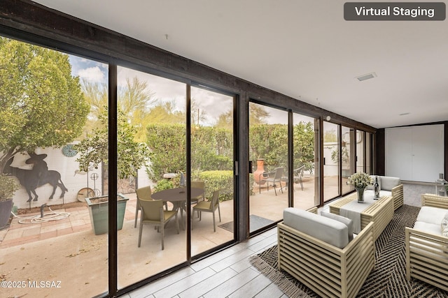 interior space featuring floor to ceiling windows