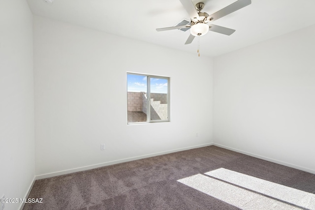 unfurnished room with baseboards, carpet flooring, and ceiling fan