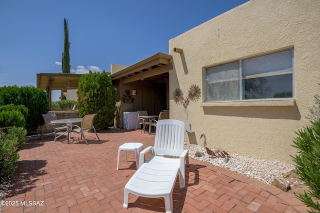 view of patio featuring outdoor dining area