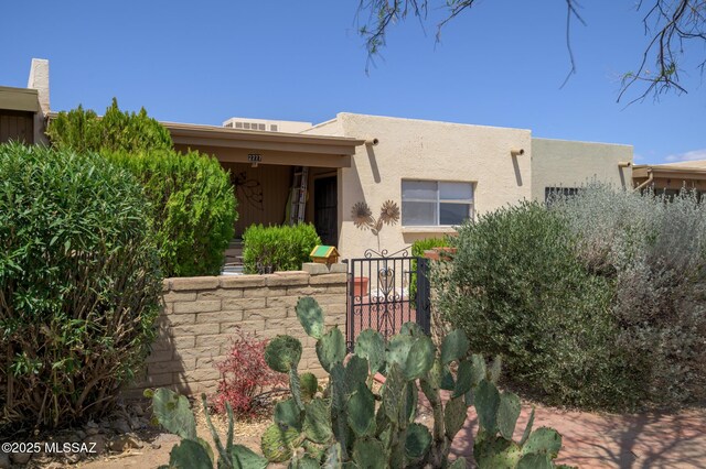adobe home featuring stucco siding