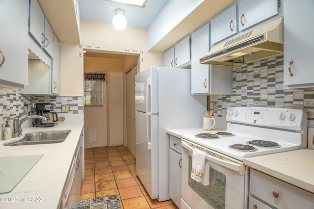 kitchen with a sink, tasteful backsplash, under cabinet range hood, light tile patterned floors, and white appliances