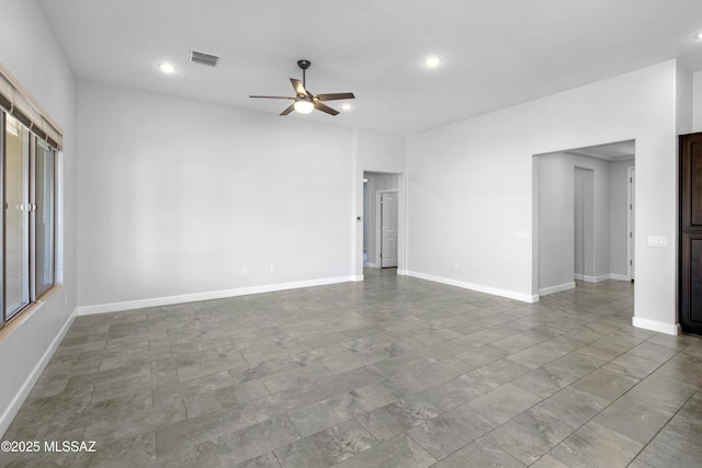spare room featuring a ceiling fan, baseboards, visible vents, and recessed lighting