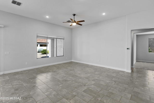 spare room featuring baseboards, a ceiling fan, recessed lighting, and visible vents