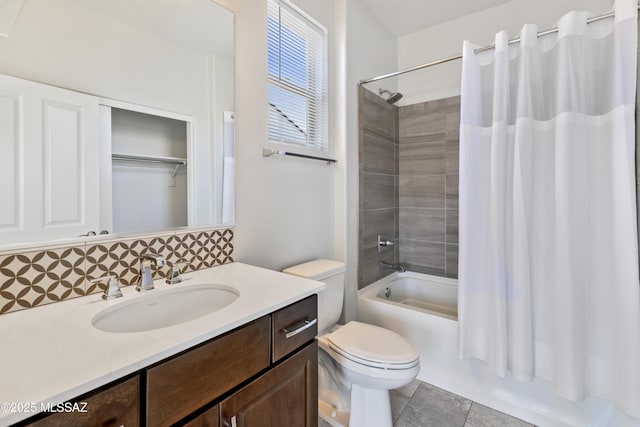 bathroom featuring vanity, toilet, tile patterned floors, tasteful backsplash, and shower / tub combo