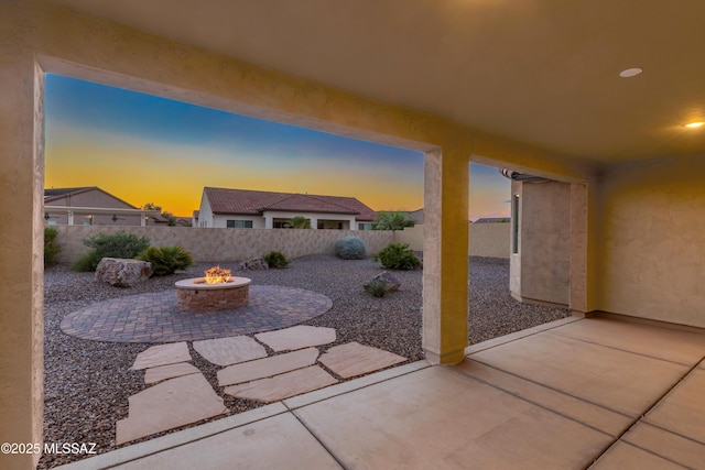 view of patio / terrace with a fenced backyard and an outdoor fire pit