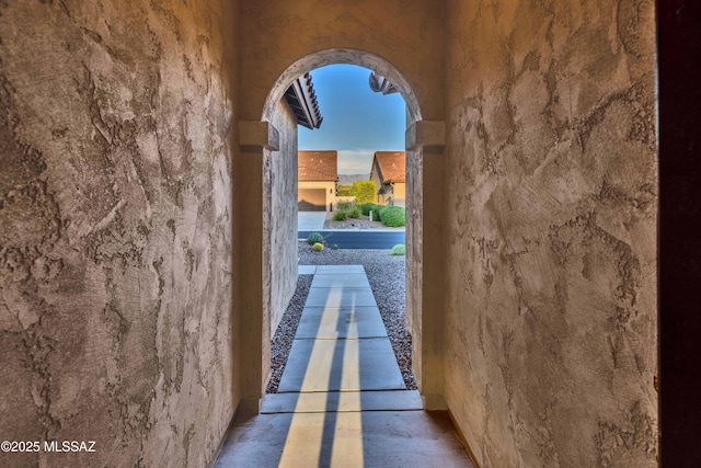 exterior space featuring arched walkways