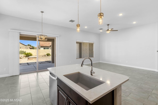 kitchen featuring a sink, hanging light fixtures, stainless steel dishwasher, and visible vents