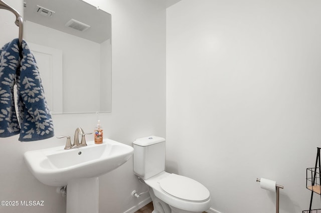14239 E Axle Dr, Vail, AZ 85641 - bathroom featuring toilet, a sink, and baseboards