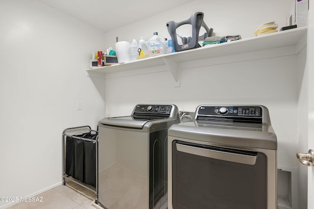 14239 E Axle Dr, Vail, AZ 85641 - laundry room with washing machine and clothes dryer, light tile patterned flooring, and baseboards