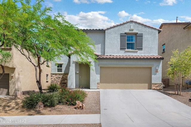 14239 E Axle Dr, Vail, AZ 85641 - mediterranean / spanish house with stucco siding, concrete driveway, stone siding, and an attached garage