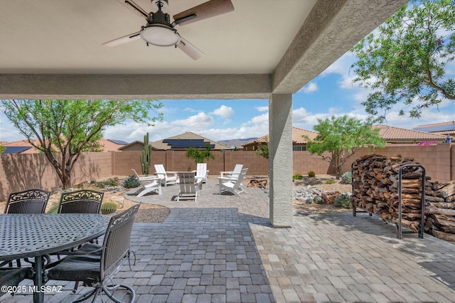 14239 E Axle Dr, Vail, AZ 85641 - fenced backyard with outdoor dining space, a patio area, and a ceiling fan