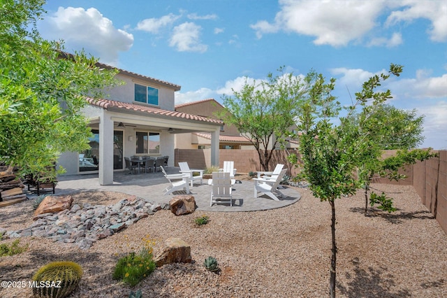 14239 E Axle Dr, Vail, AZ 85641 - back of property featuring ceiling fan, a fenced backyard, a tiled roof, a patio, and stucco siding
