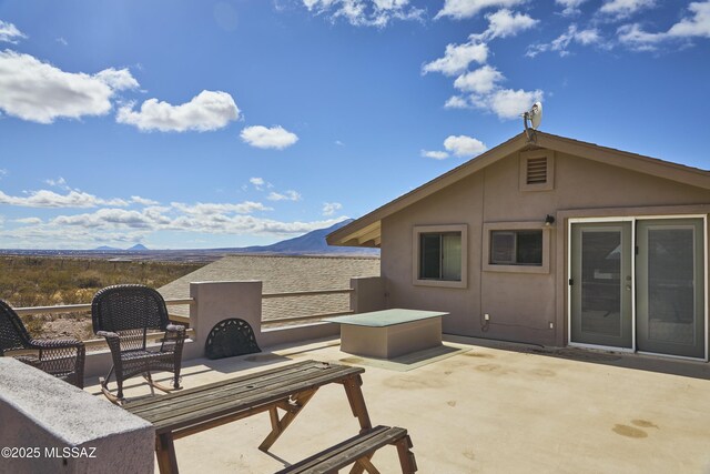view of patio / terrace with a mountain view