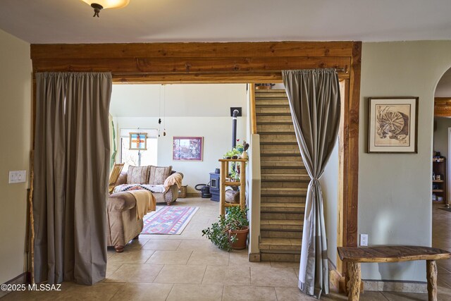 stairway featuring arched walkways