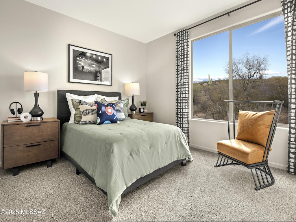 carpeted bedroom featuring baseboards