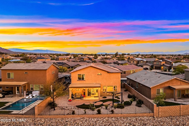 3576 W Granite Vista Dr, Tucson, AZ 85742 - rear view of property with a residential view, a fenced backyard, a patio area, and a mountain view