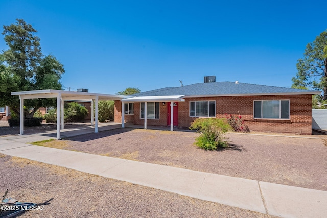 6517 E Cooper St, Tucson, AZ 85710 - ranch-style home with brick siding and a carport