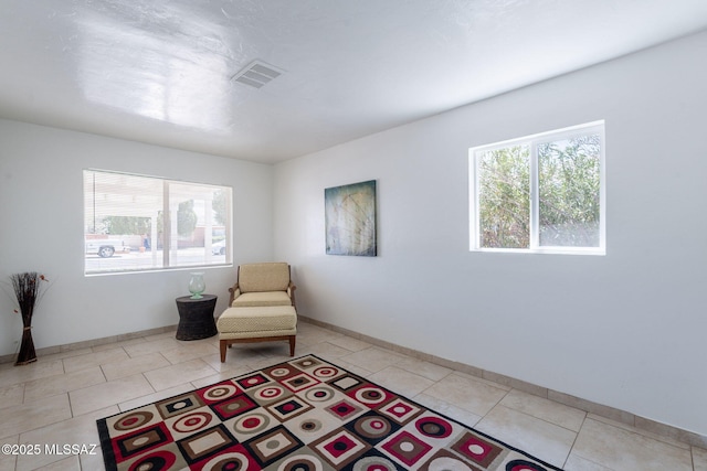 6517 E Cooper St, Tucson, AZ 85710 - sitting room with light tile patterned floors and baseboards