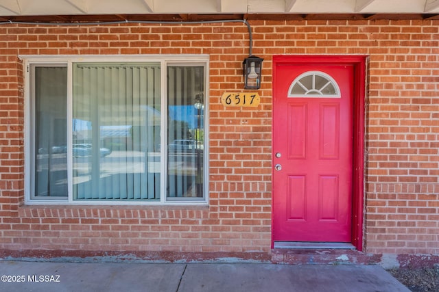 6517 E Cooper St, Tucson, AZ 85710 - doorway to property with brick siding