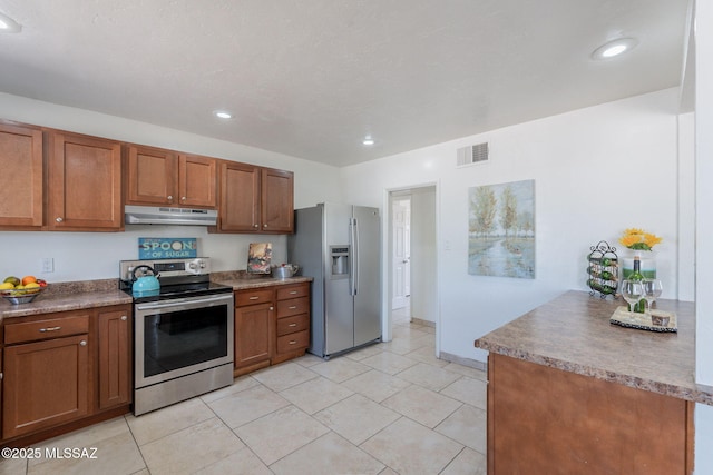 6517 E Cooper St, Tucson, AZ 85710 - kitchen featuring stainless steel appliances, under cabinet range hood, brown cabinetry, recessed lighting, and light tile patterned flooring