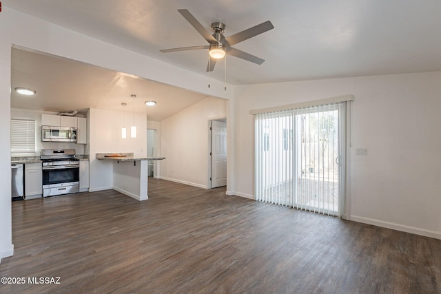 unfurnished living room with baseboards, lofted ceiling, dark wood-style floors, and ceiling fan