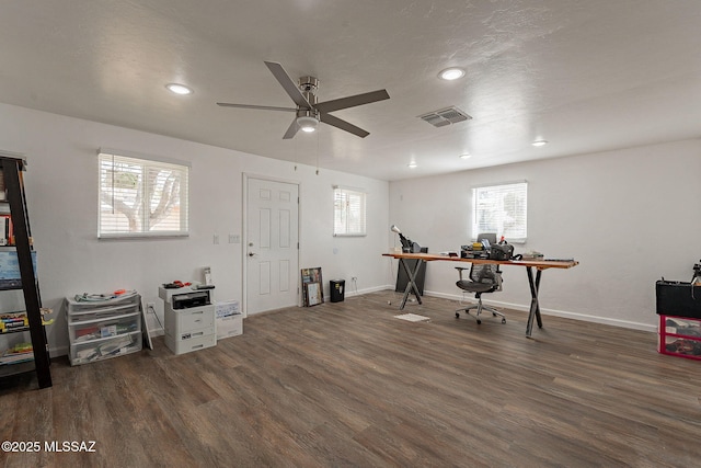misc room with baseboards, visible vents, wood finished floors, and ceiling fan