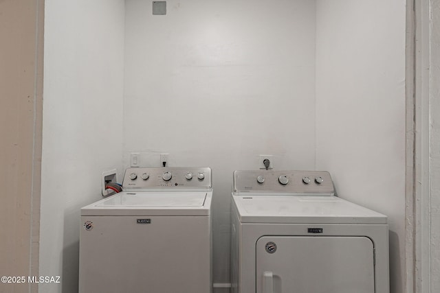 laundry area with washing machine and dryer and laundry area