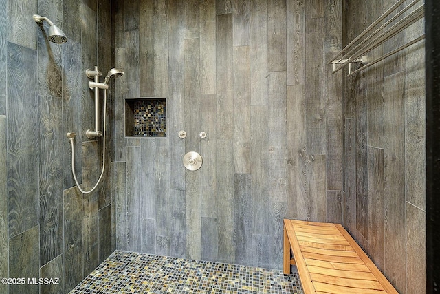 bathroom with tiled shower