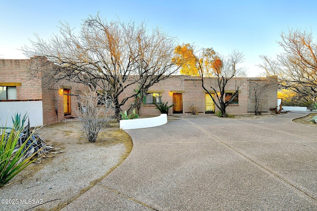 view of front of house featuring brick siding