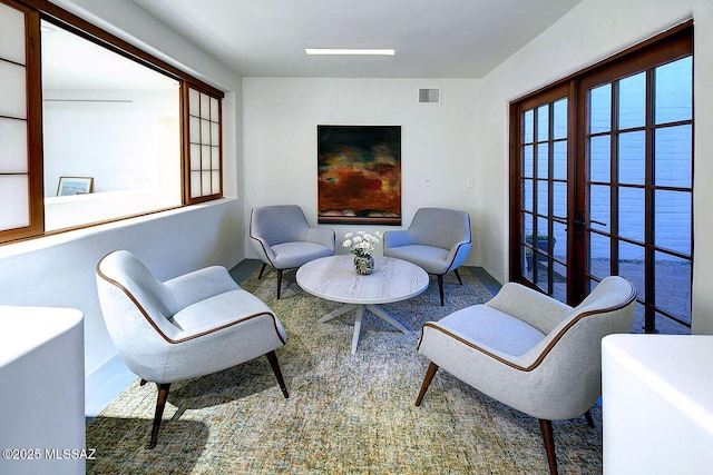 sitting room featuring visible vents