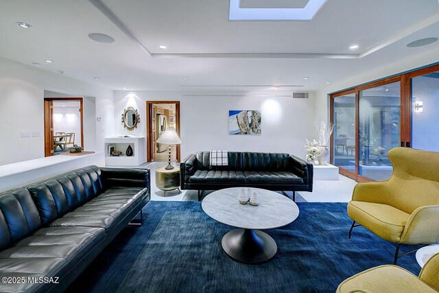 living room with visible vents and recessed lighting