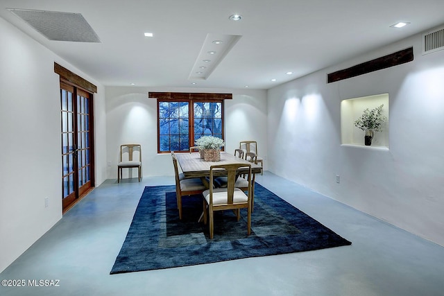 dining space with visible vents, french doors, recessed lighting, and concrete flooring