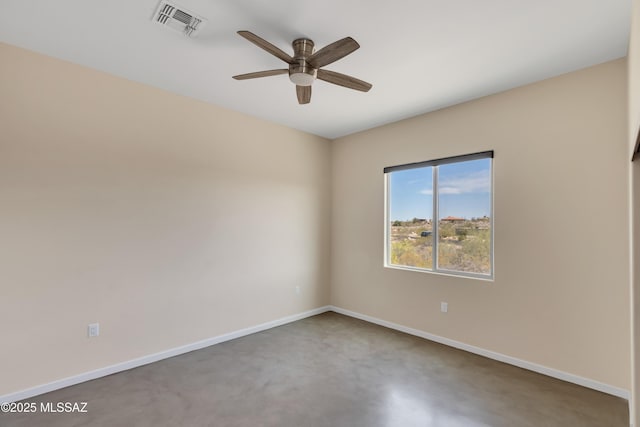 empty room with visible vents, baseboards, and ceiling fan