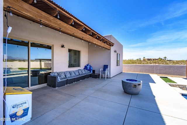 view of patio with an outdoor fire pit